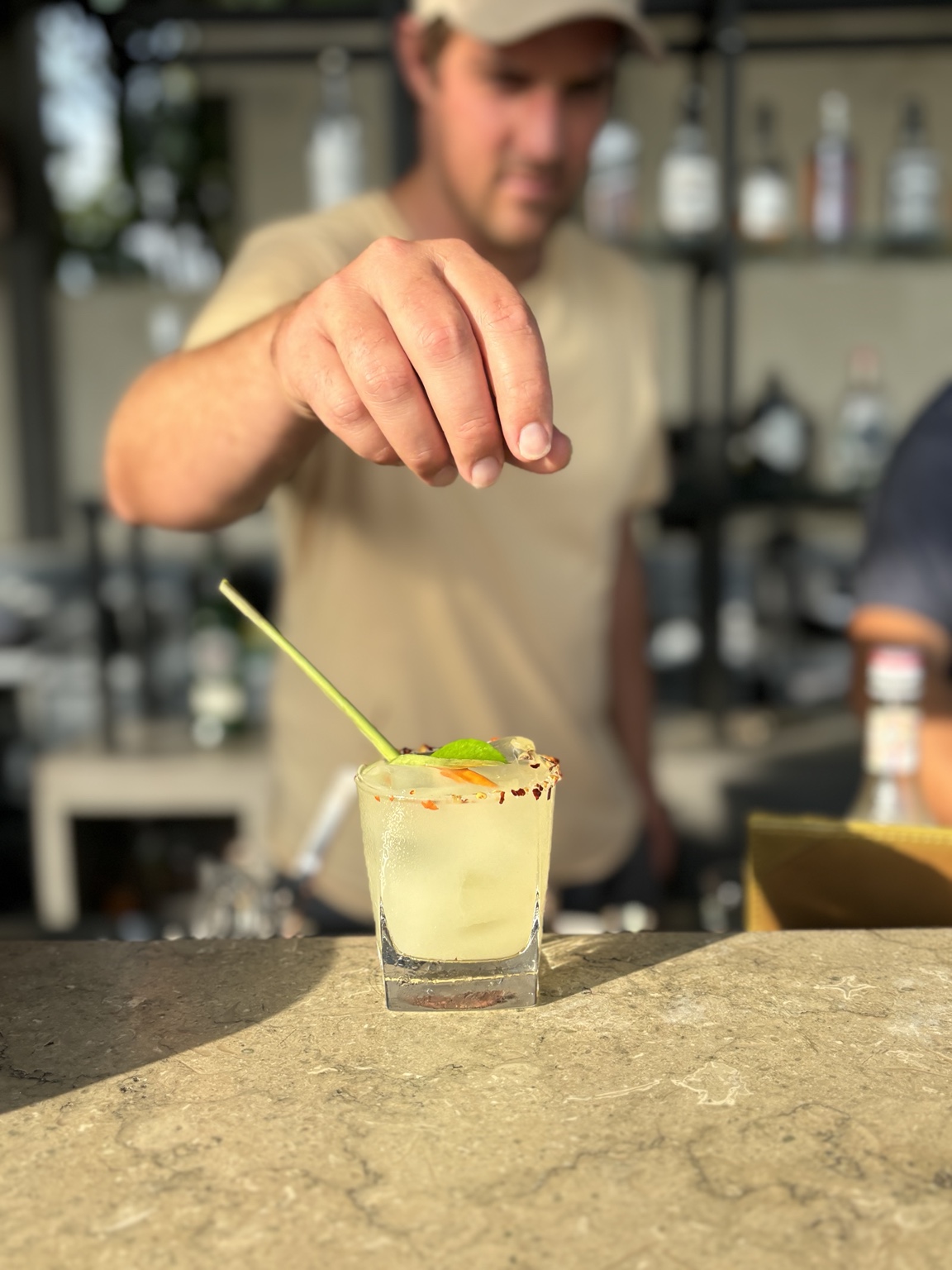 A drink being finished at the bar