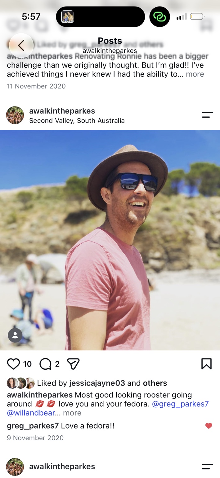 Greg in his hat and sunglasses at the beach